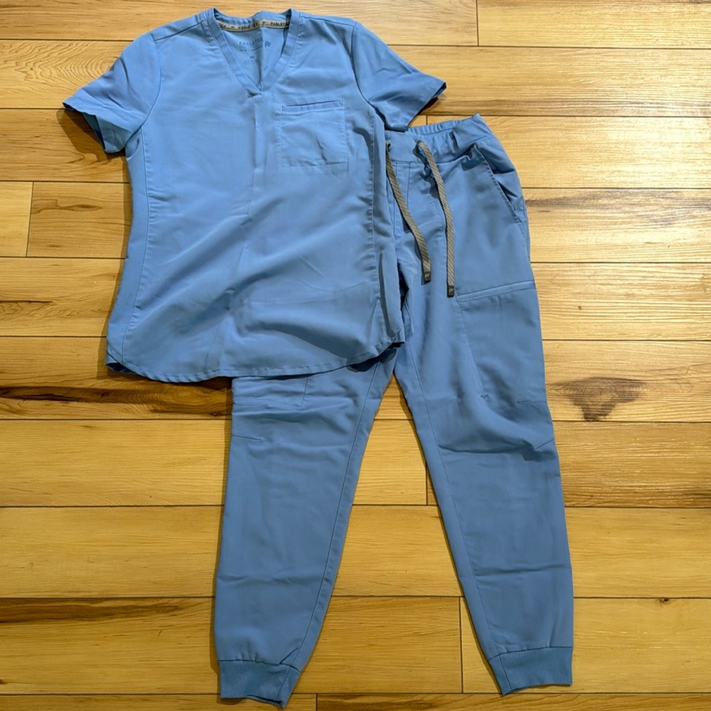 Light blue Fabletics scrub set.